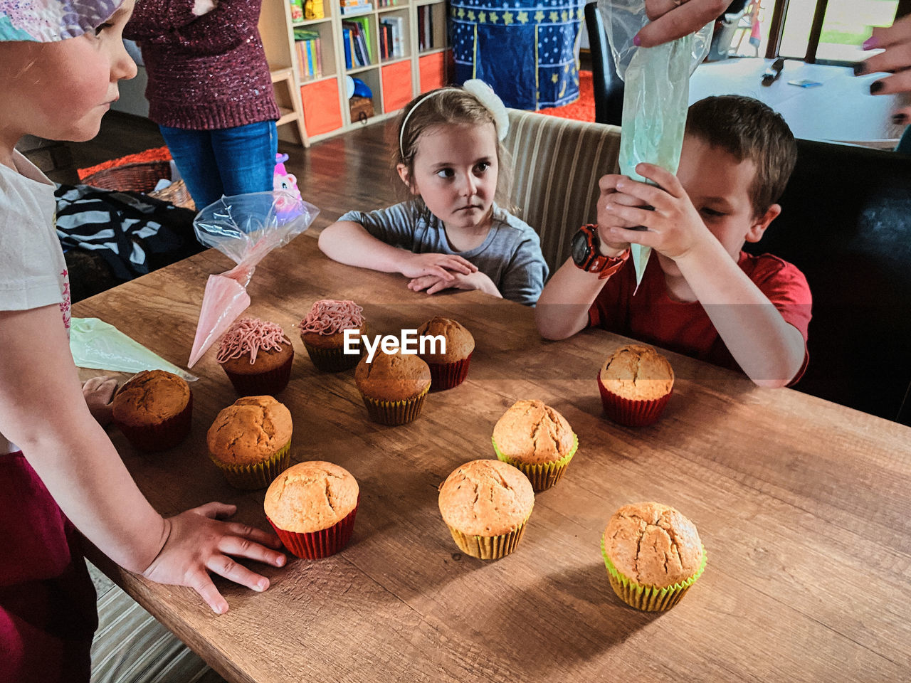 High angle view of kids sitting at restaurant