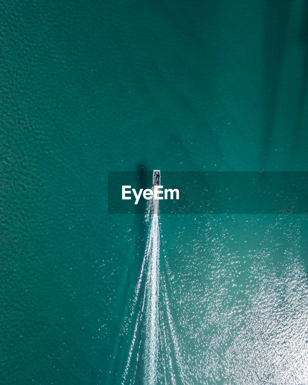 Aerial view of boat sailing on sea