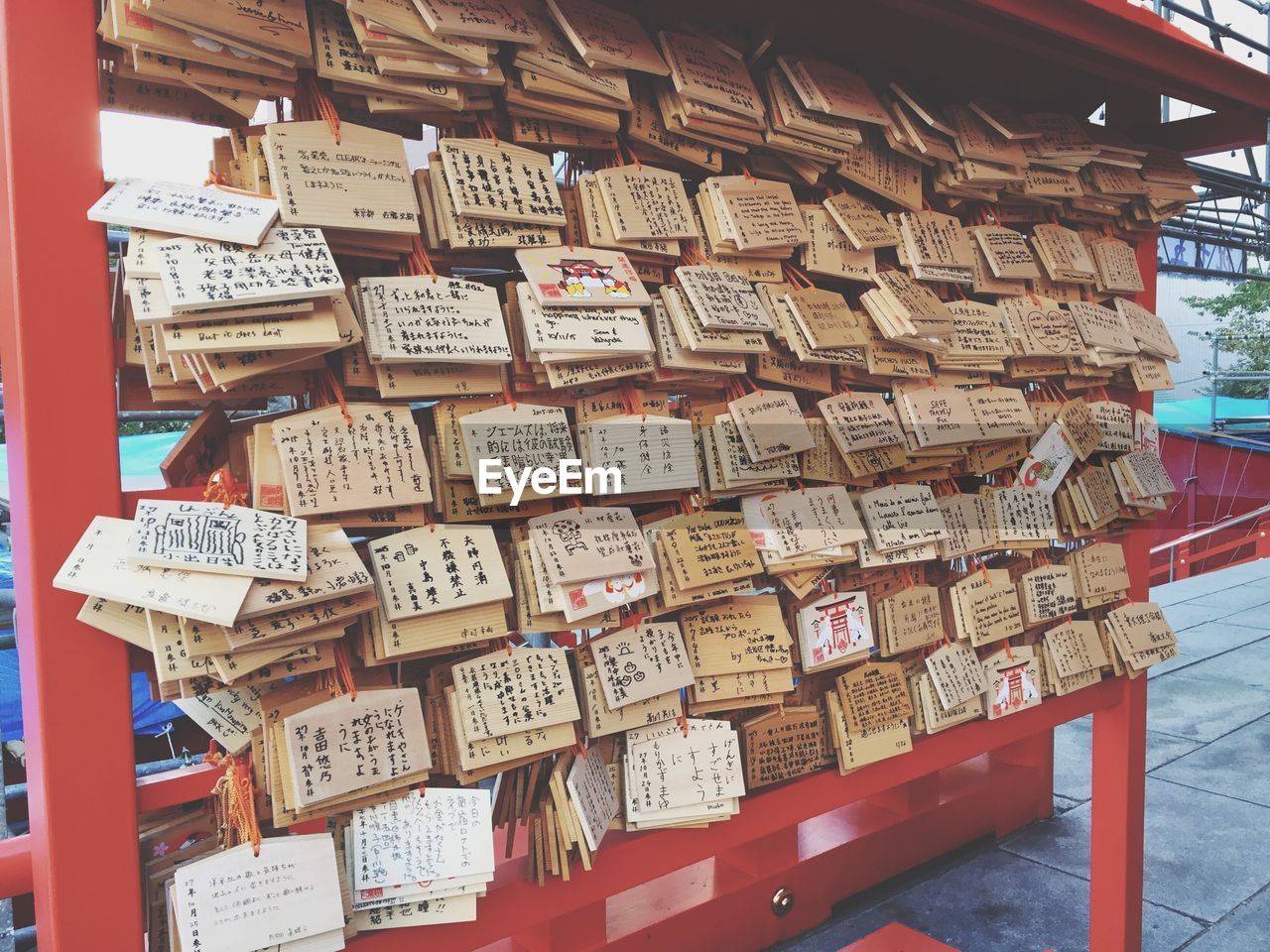 Praying notes on stand at hanazono jinja shrine