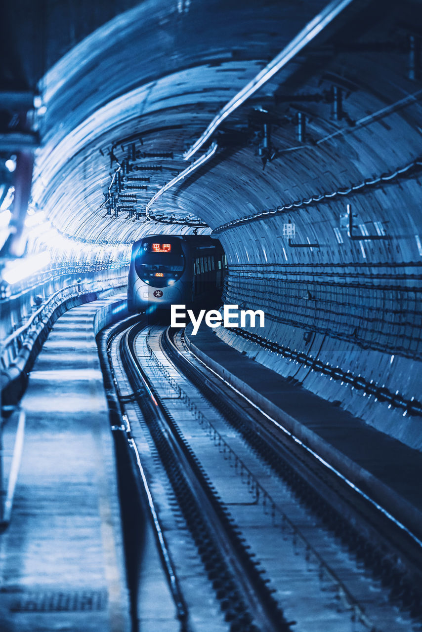 View of train on railroad track in tunnel