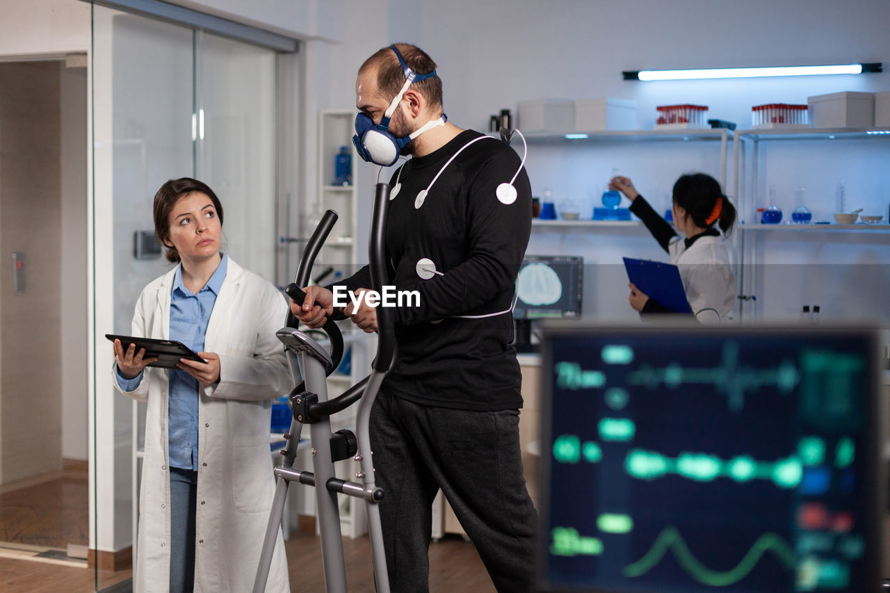 Doctor examining endurance level of patient