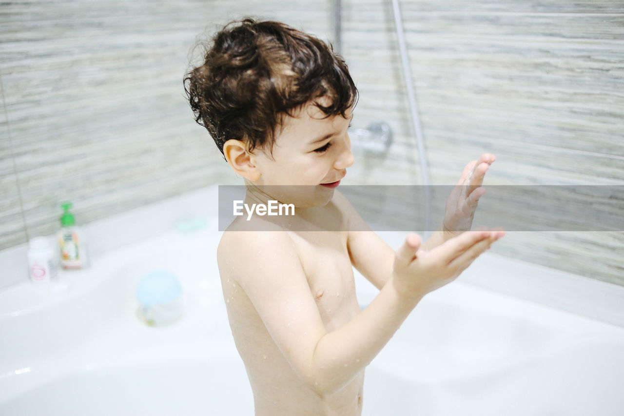 A little boy bathes in a bath. personal hygiene in childhood. high quality photo