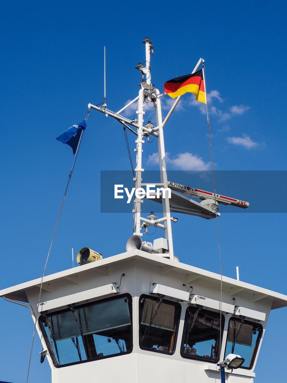 LOW ANGLE VIEW OF SAILBOAT AGAINST BLUE SKY