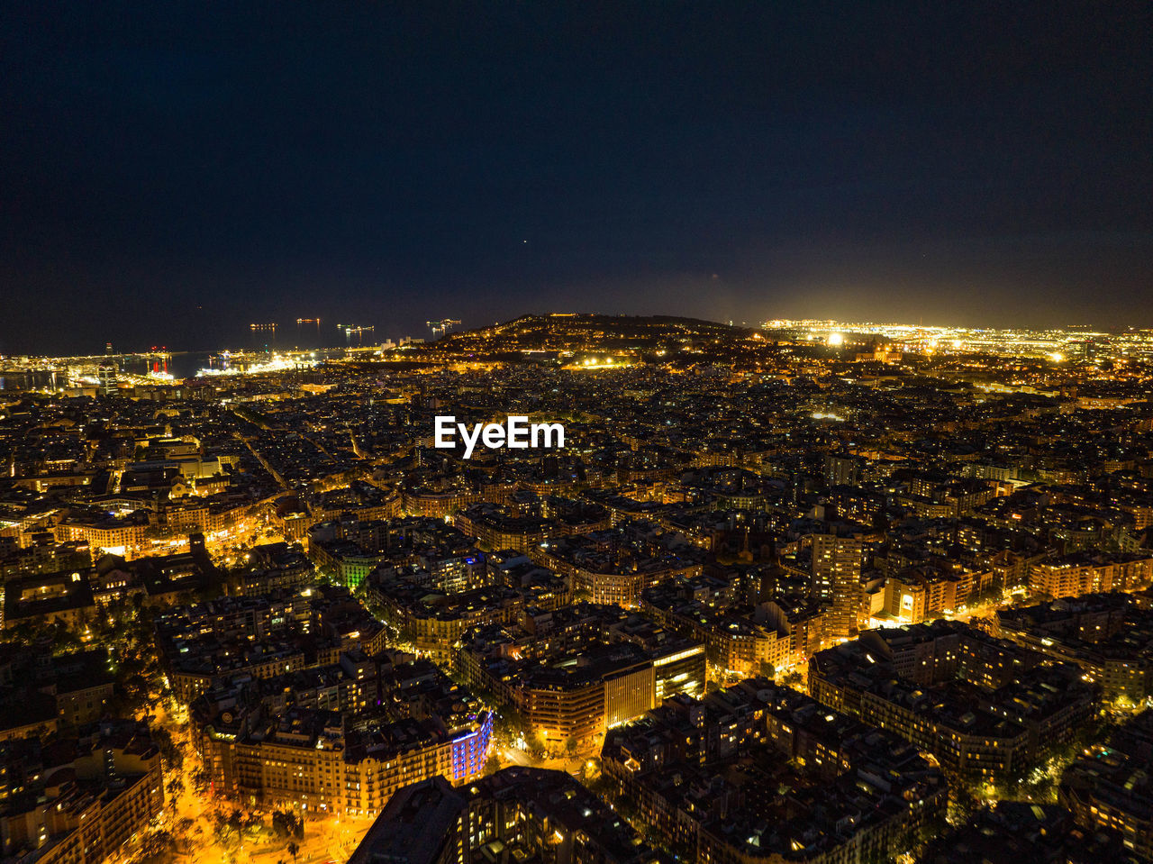high angle view of illuminated cityscape at night