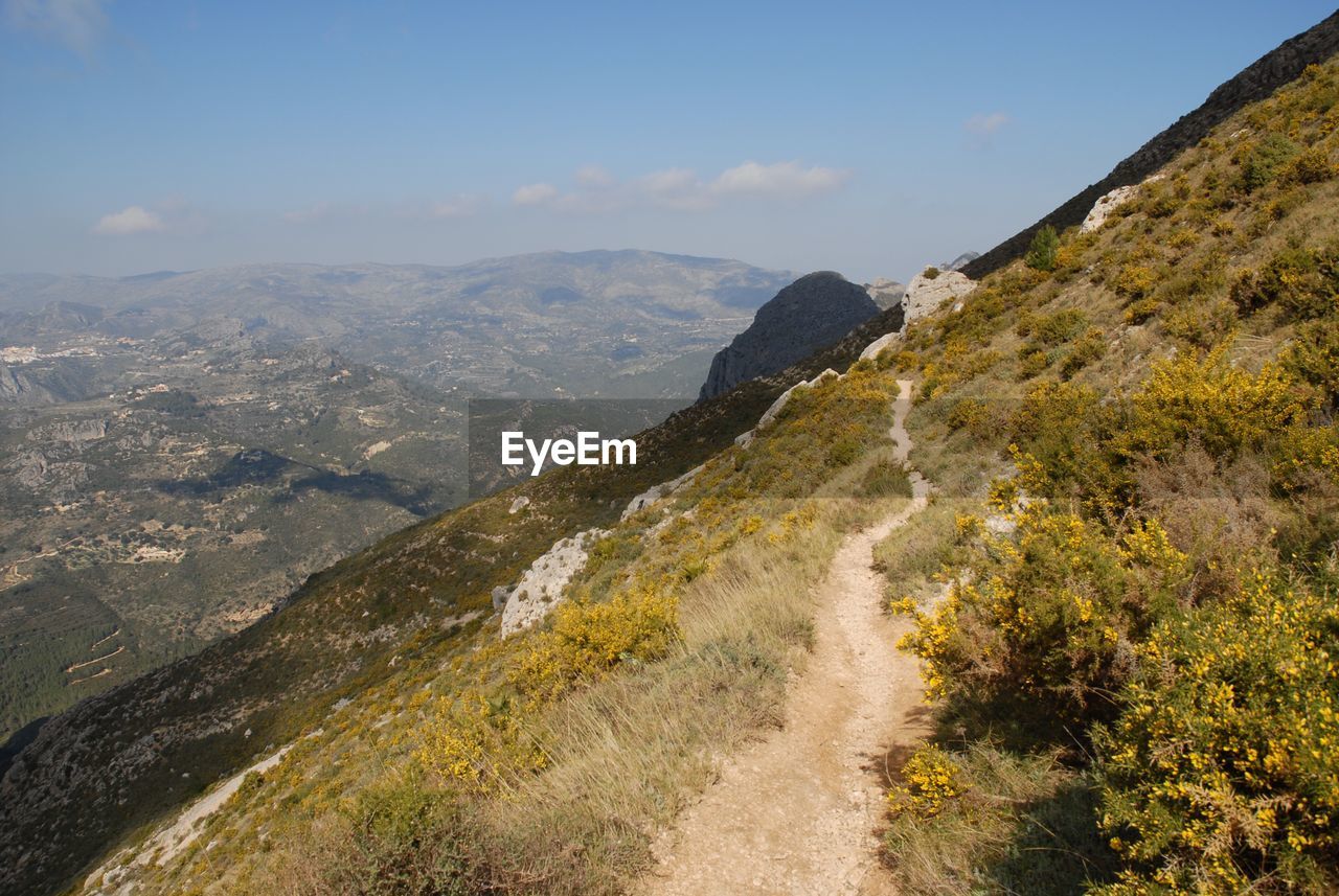 Looking back along the mountain track to the bernia forts, sierra bernia, alicante province, spain