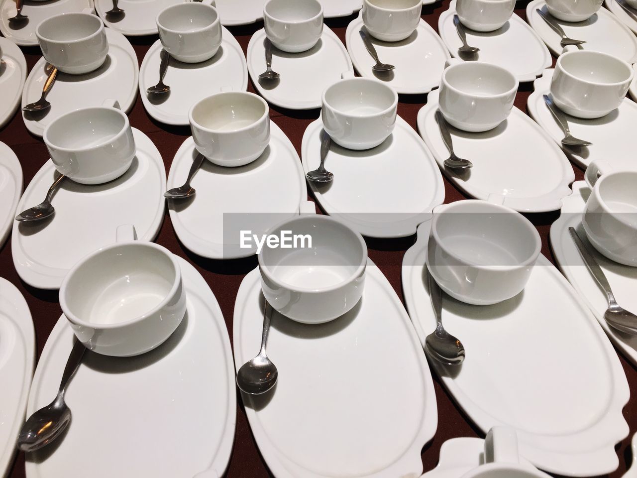 Full frame shot of plates and bowls arranged on table