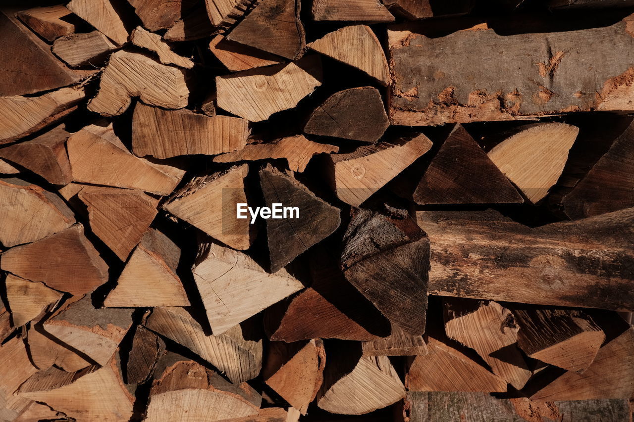 FULL FRAME SHOT OF LOGS STACK