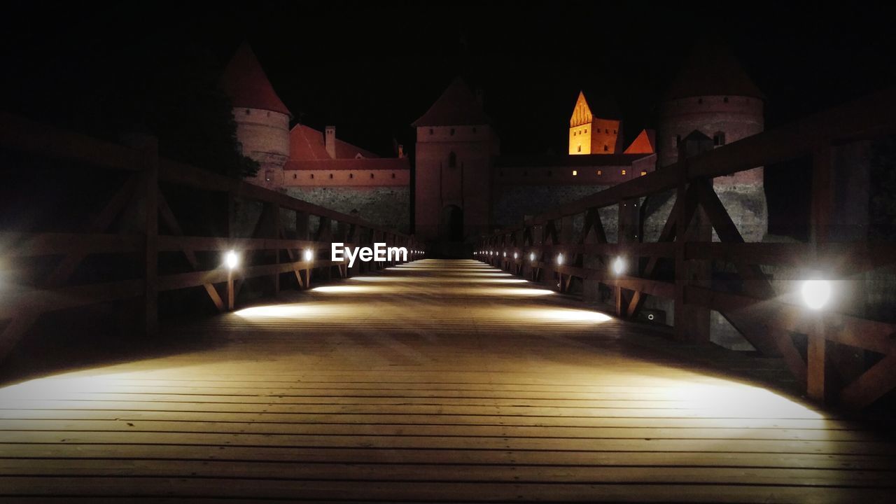 VIEW OF ILLUMINATED BUILDINGS AT NIGHT