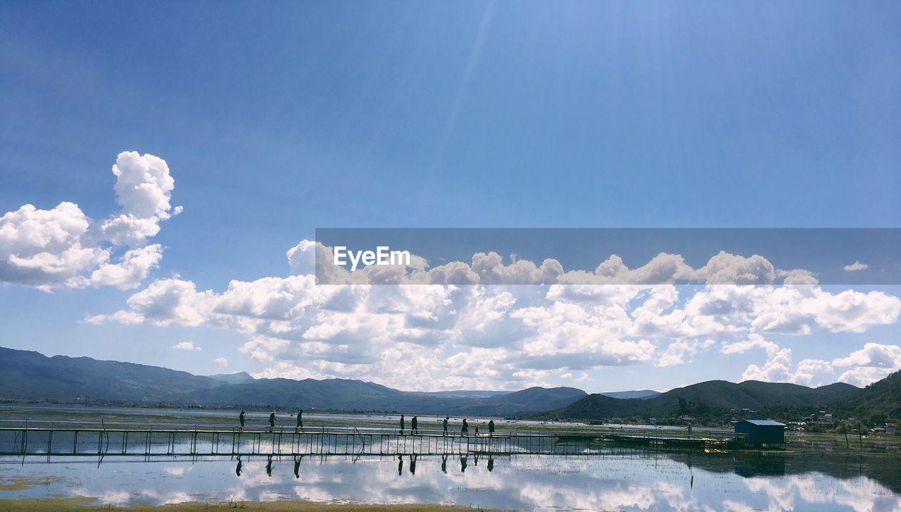 Scenic view of calm lake against mountain range