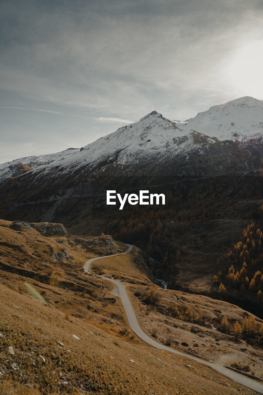 Scenic view of snowcapped mountains against sky