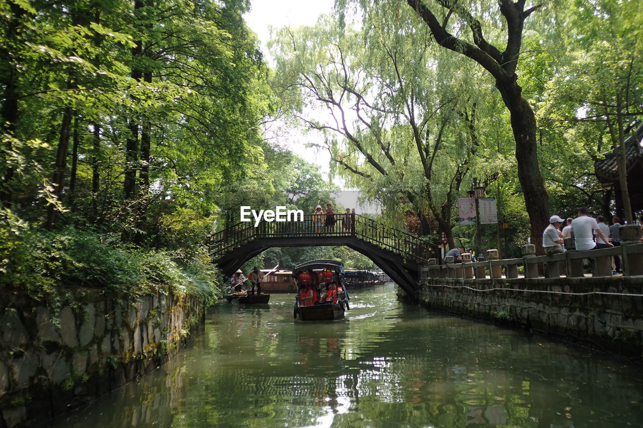 BRIDGE OVER CANAL ALONG TREES