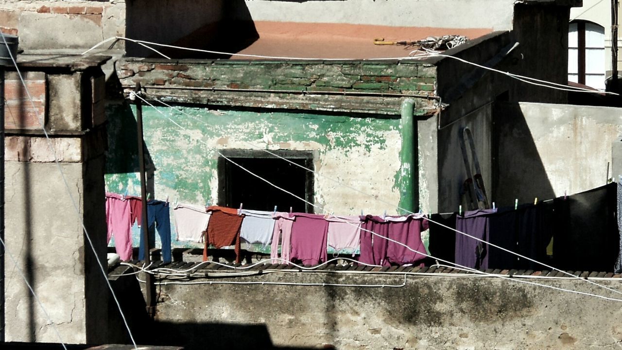 Laundry drying outside house