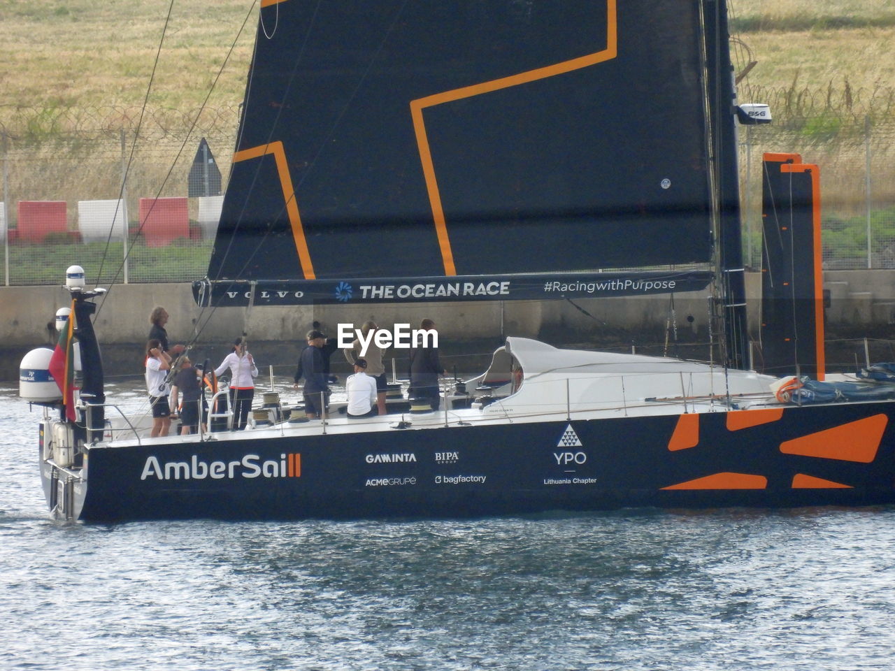 GROUP OF PEOPLE ON BOAT IN SEA