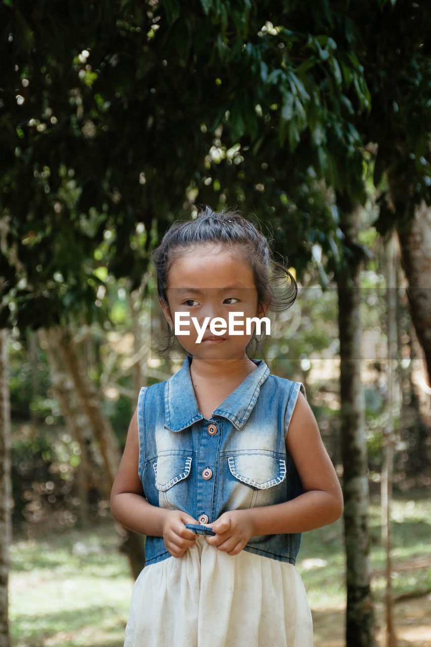 A young girl poses for a potrait in rangsapara, goalpara 