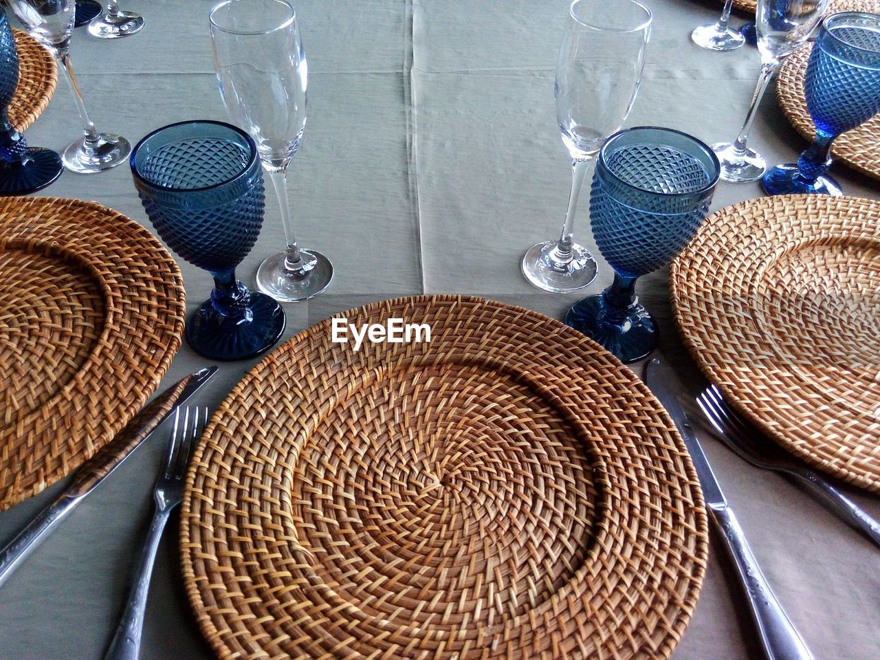 High angle view of wicker plates on table