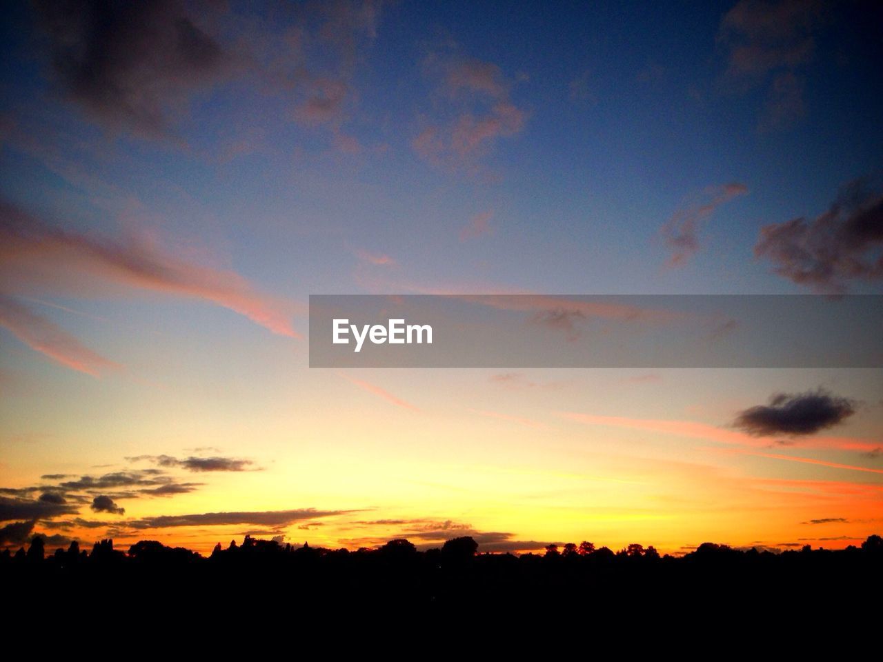 Silhouette landscape against scenic sky