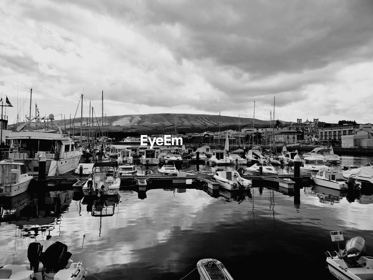 HARBOR AGAINST CLOUDY SKY