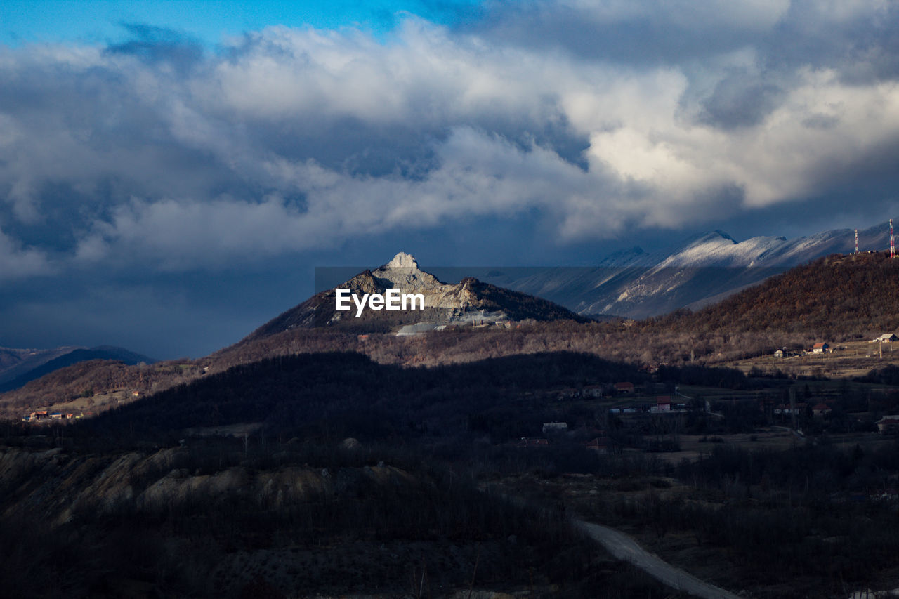 Scenic view of snowcapped mountains against sky