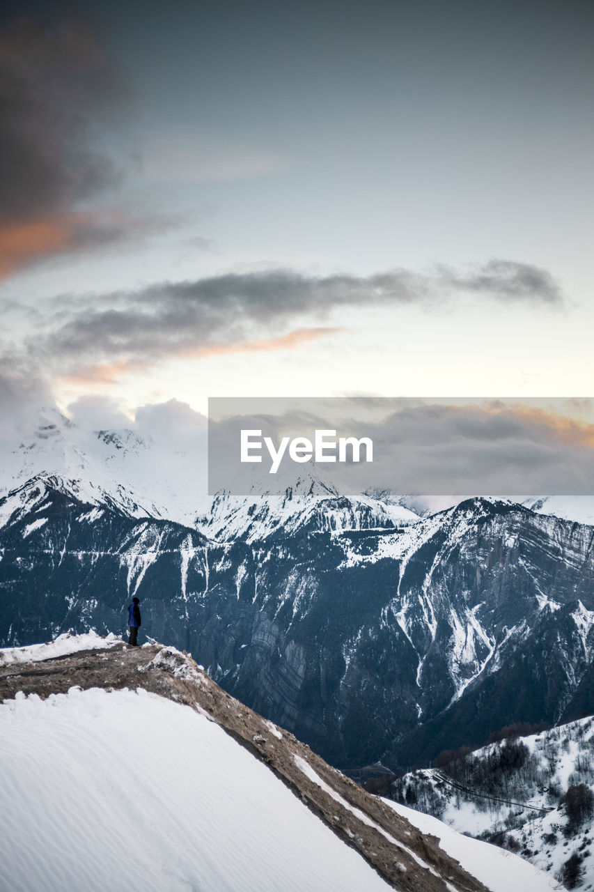 Scenic view of snowcapped mountains against sky