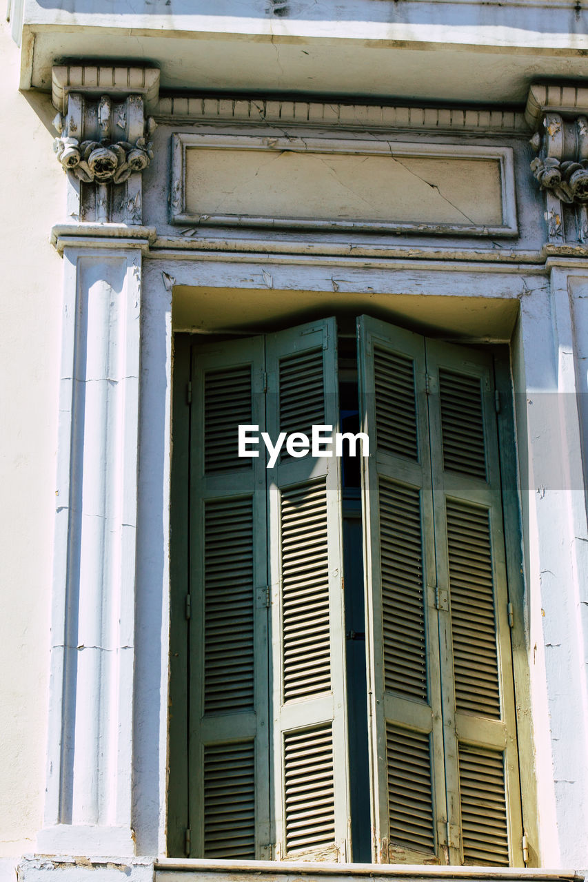 LOW ANGLE VIEW OF WINDOW ON BUILDING