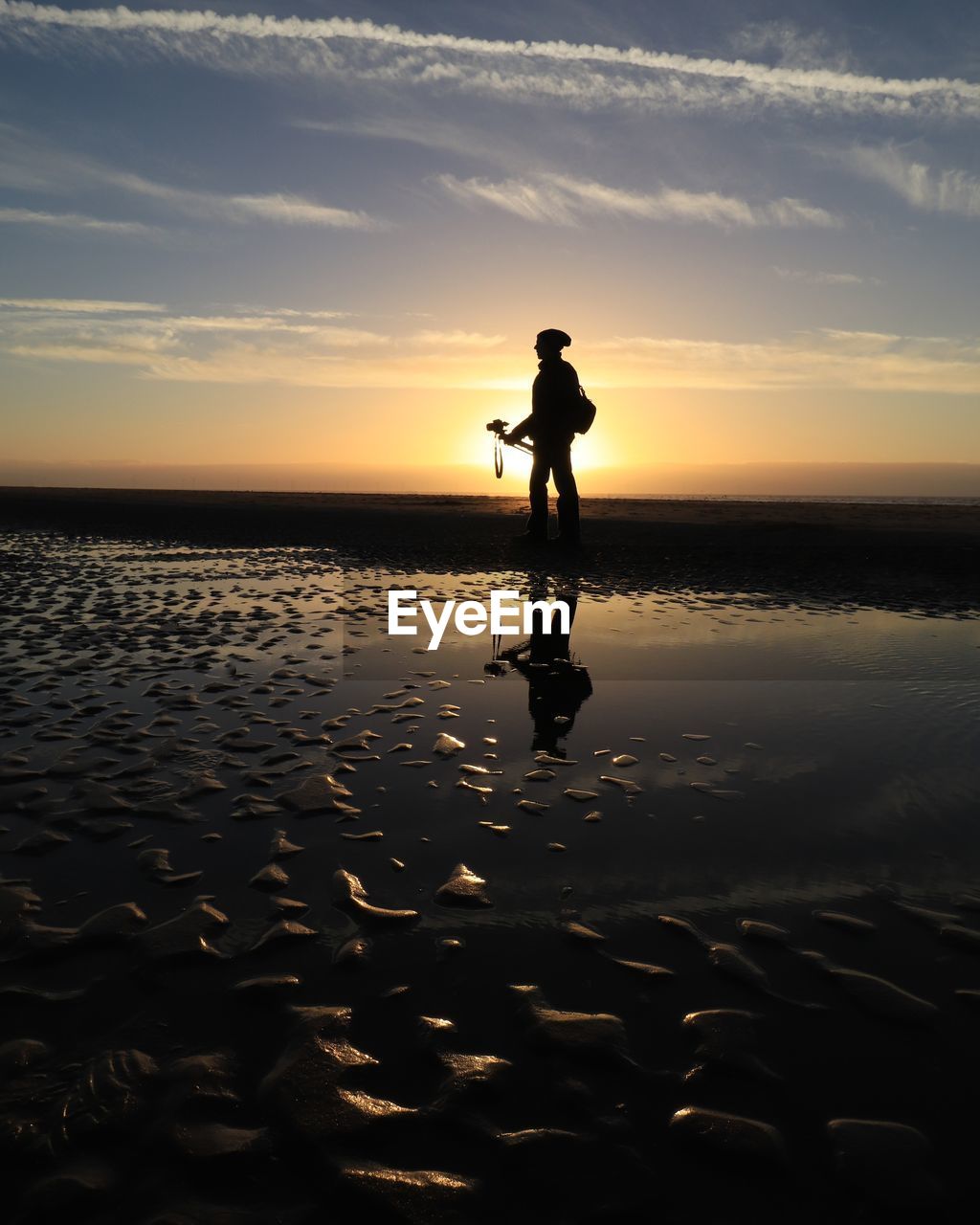 SILHOUETTE PERSON ON BEACH DURING SUNSET