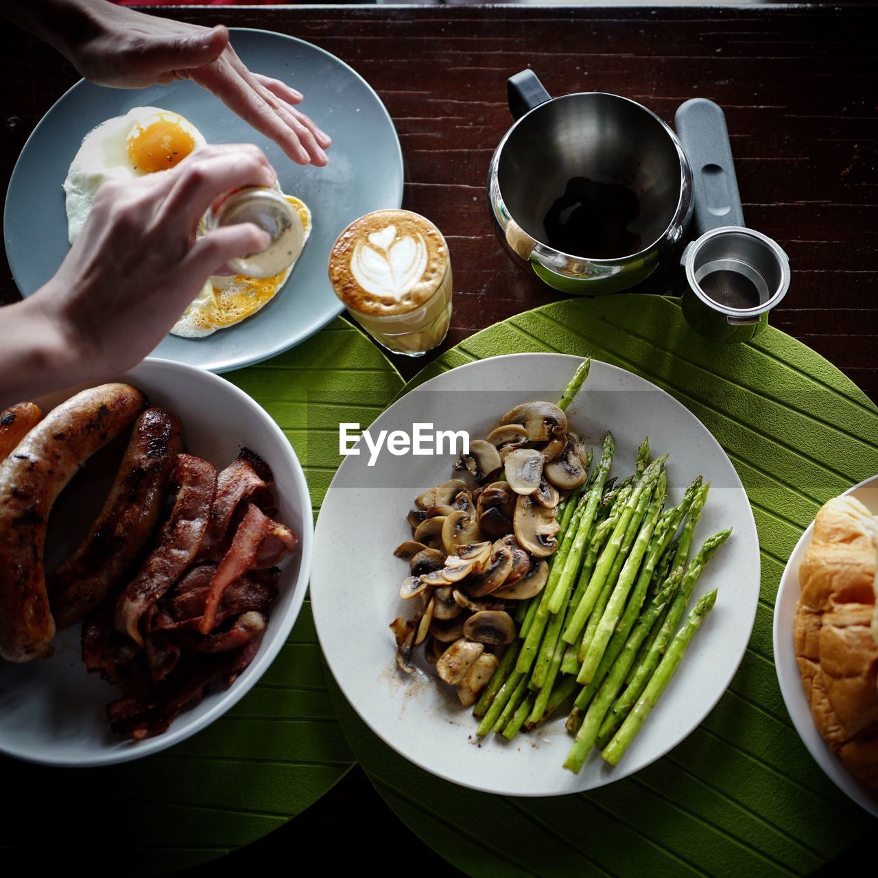 Cropped image of person having meal served on table