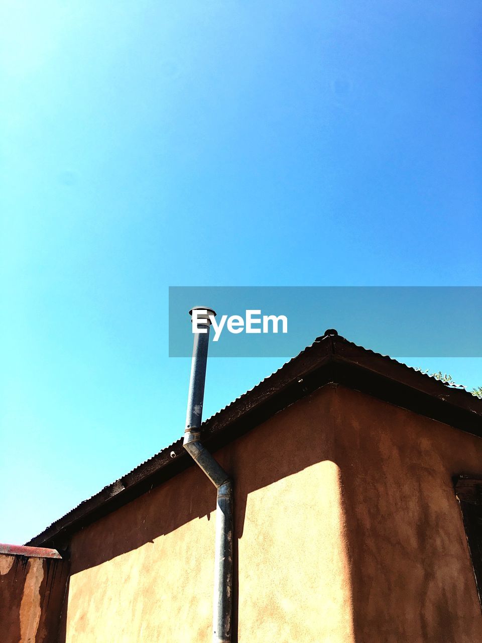 Low angle view of built structure against blue sky