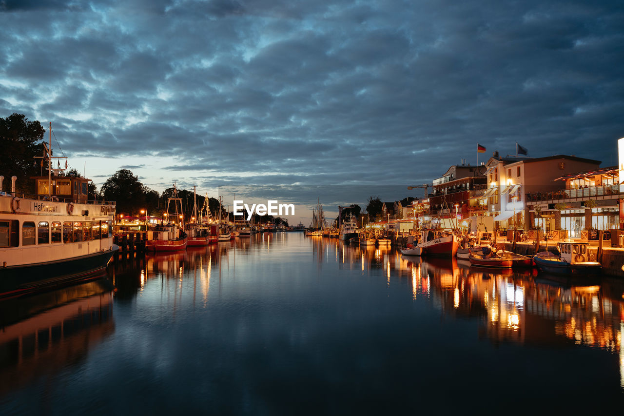 Illuminated buildings in water warnemünde alter strom