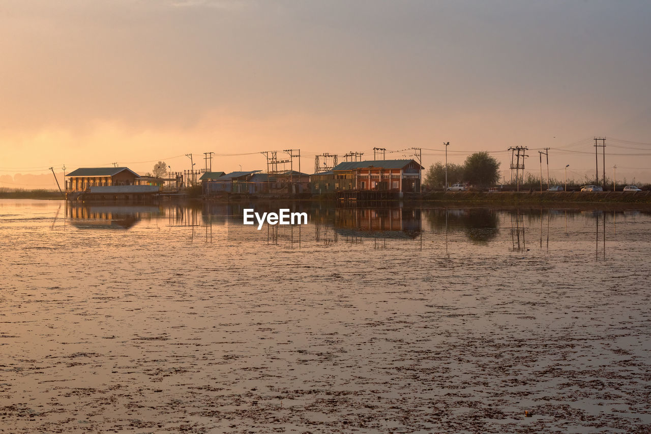 Scenic view of lake against sky during sunset