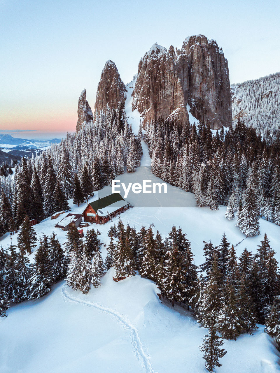 Scenic view of snow covered mountains against sky