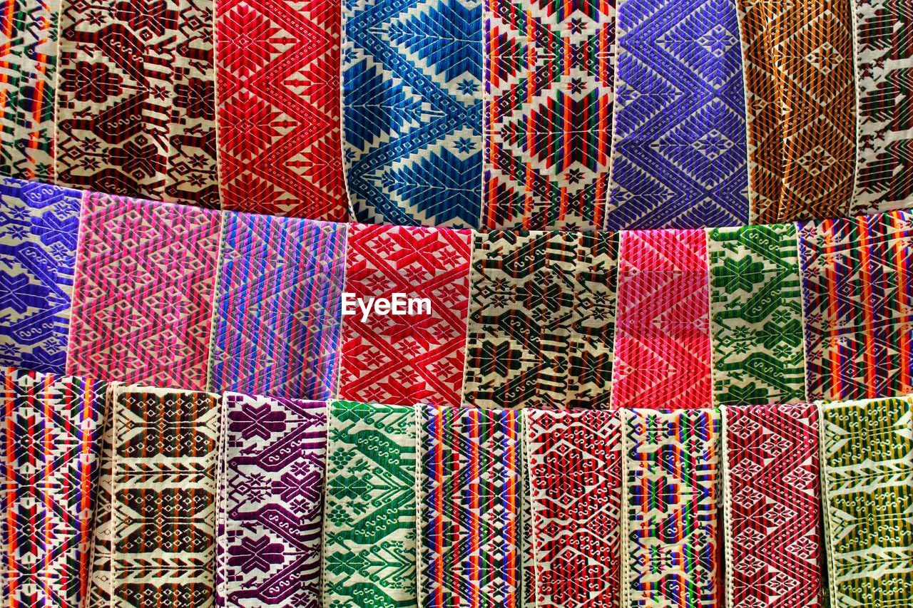 Full frame shot of colorful fabrics for sale in market