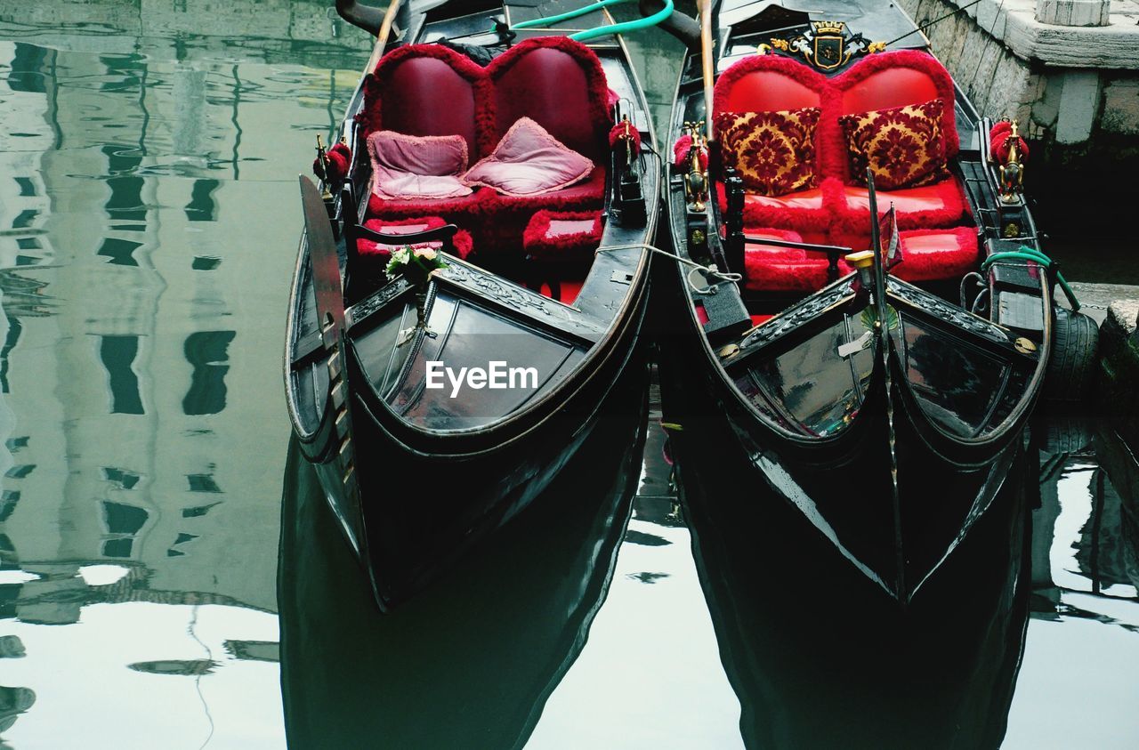 Gondolas moored in canal. venice. italy.