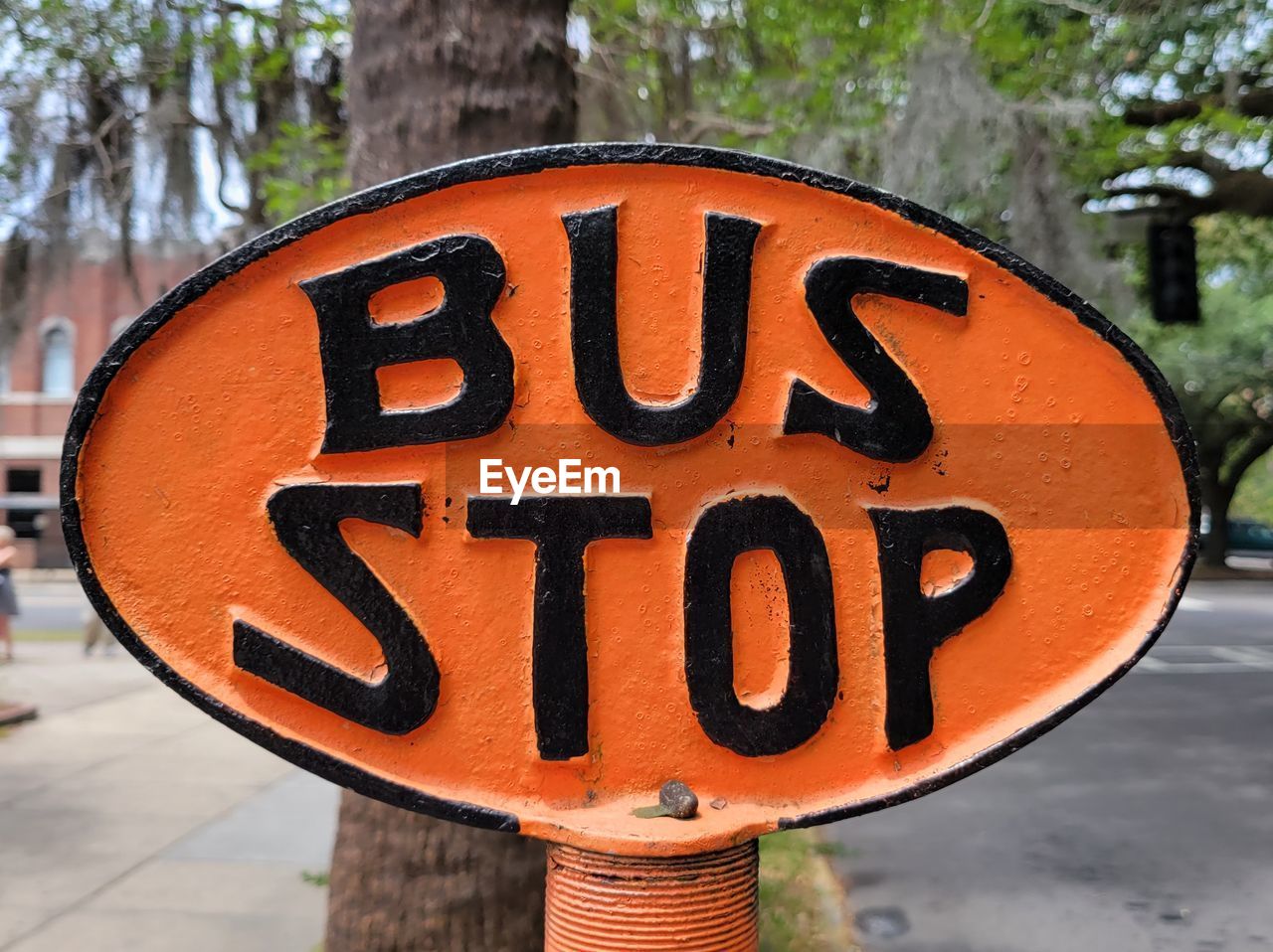 communication, sign, text, road sign, traffic sign, road, focus on foreground, day, signage, western script, orange color, close-up, tree, no people, outdoors, city, red, nature, art, street, stop sign, yellow, number, shape, information sign, guidance