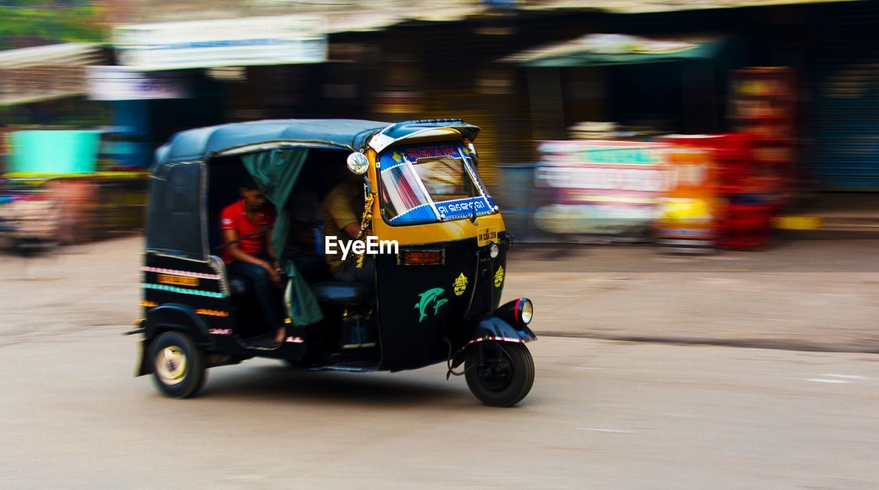 BLURRED MOTION OF CAR ON ROAD