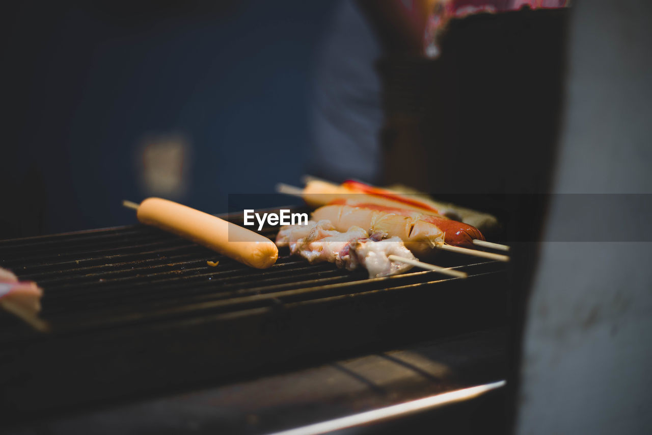 Close-up of meat on barbecue grill