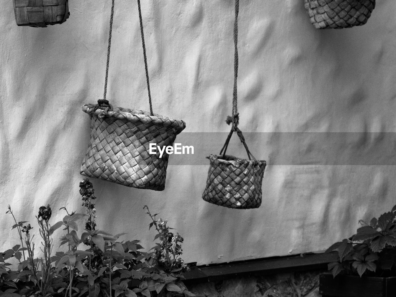 CLOTHES HANGING IN BASKET WITH WICKER
