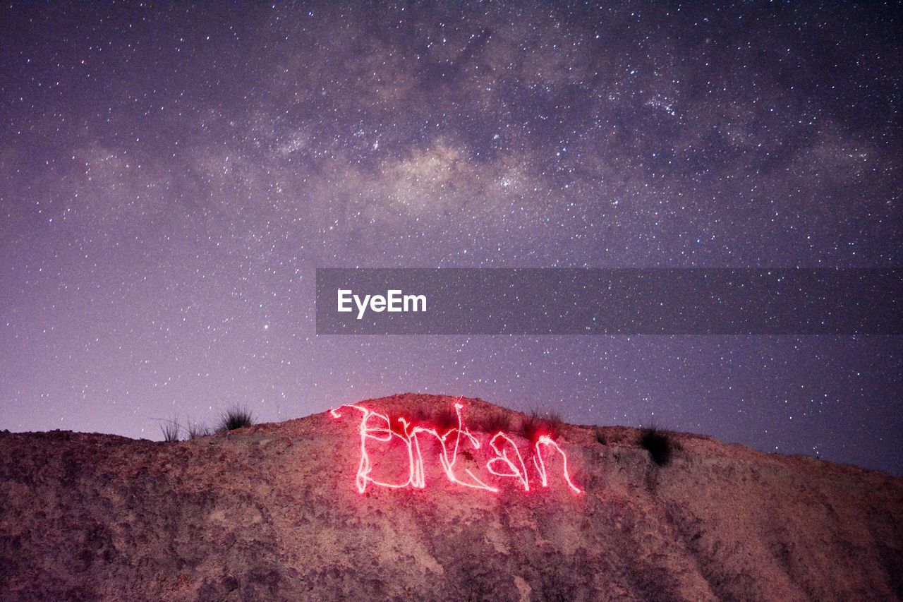 VIEW OF TEXT ON DESERT AGAINST SKY