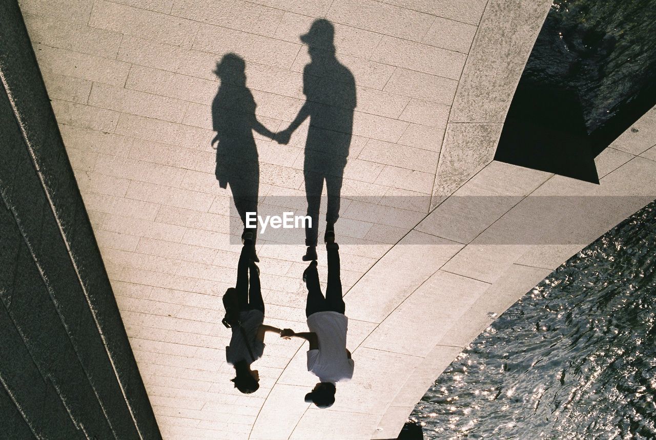 Upside down image of couple standing on promenade
