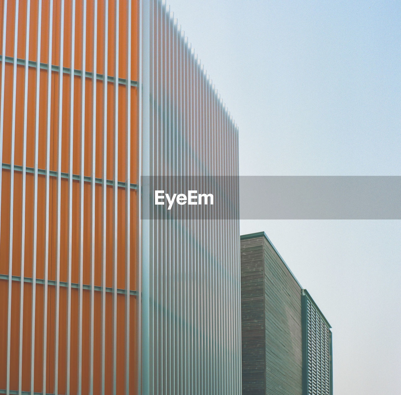 Low angle view of modern building against clear sky