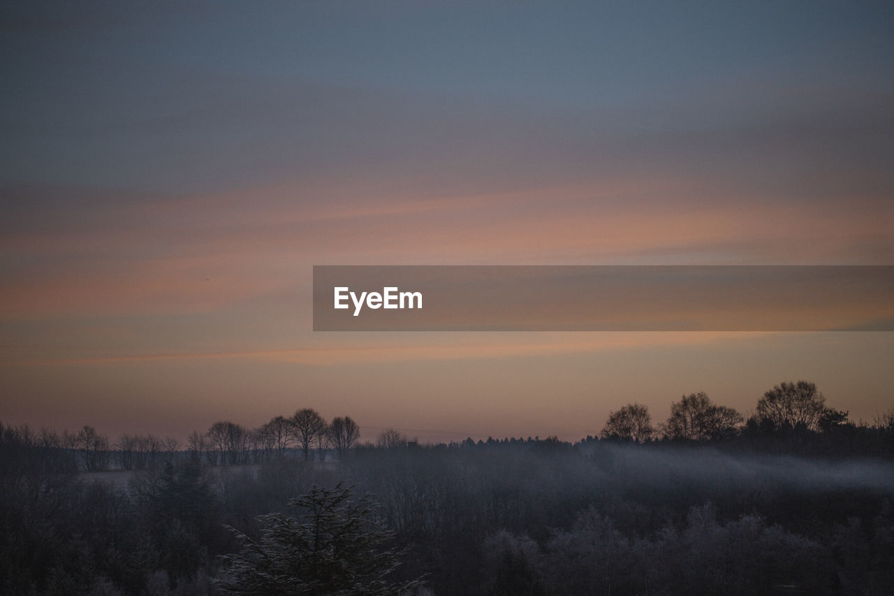 Scenic view of landscape against sky during sunset