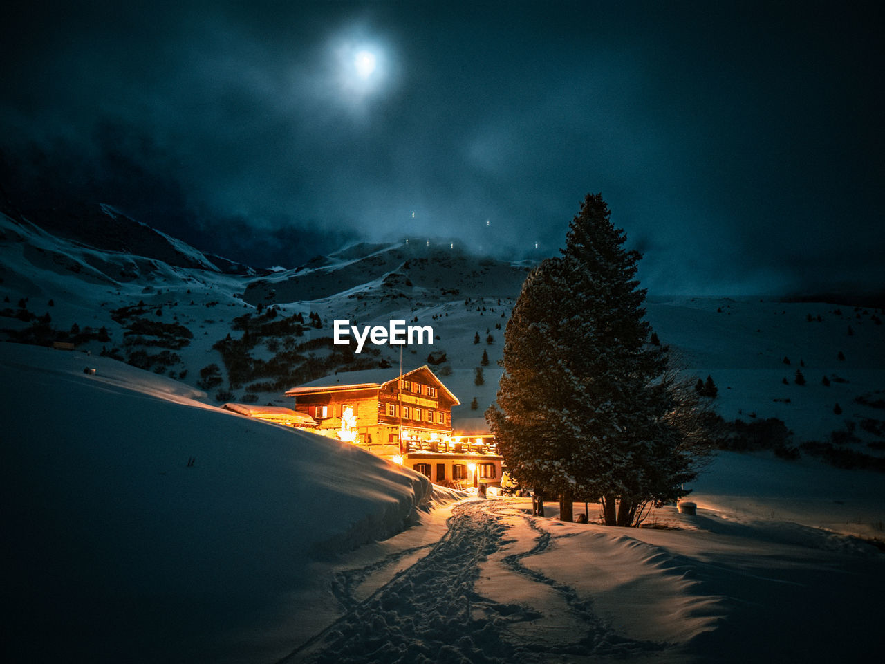 Scenic view of snowcapped mountains against sky during sunset, hotel in swiss alps moonshine 