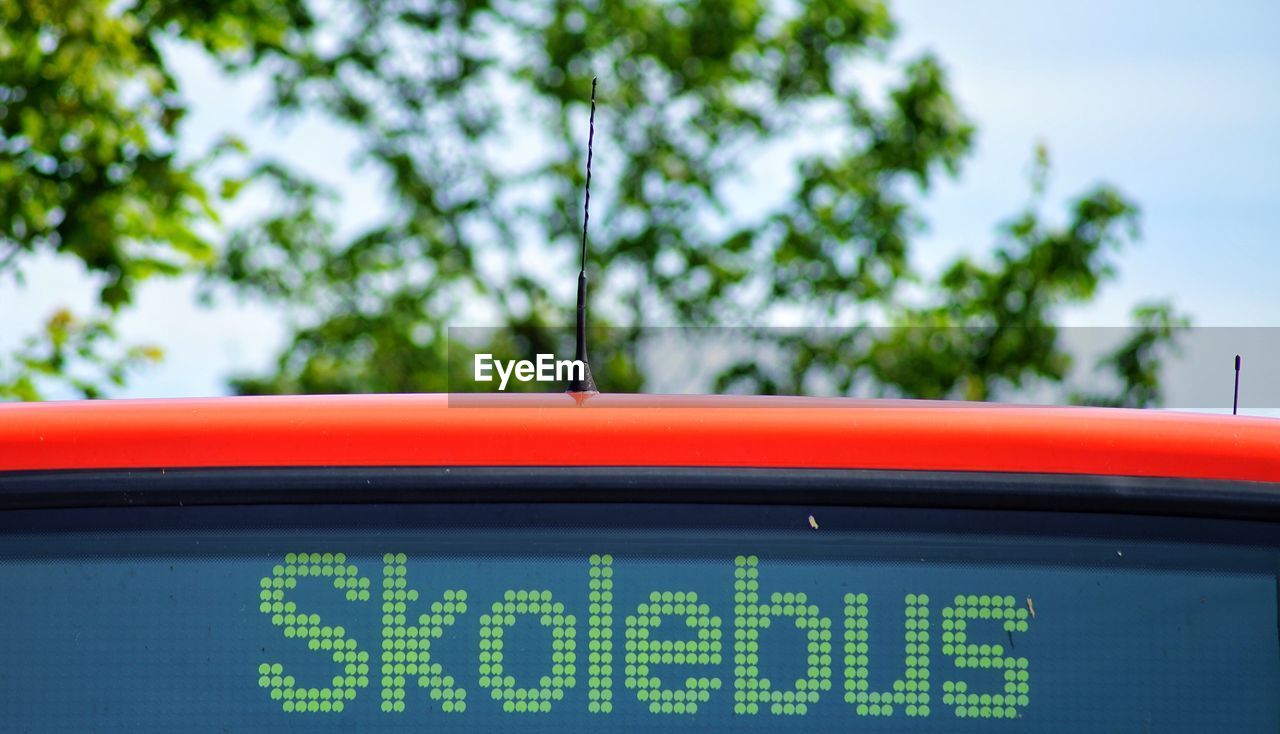 Low angle view of text on school bus