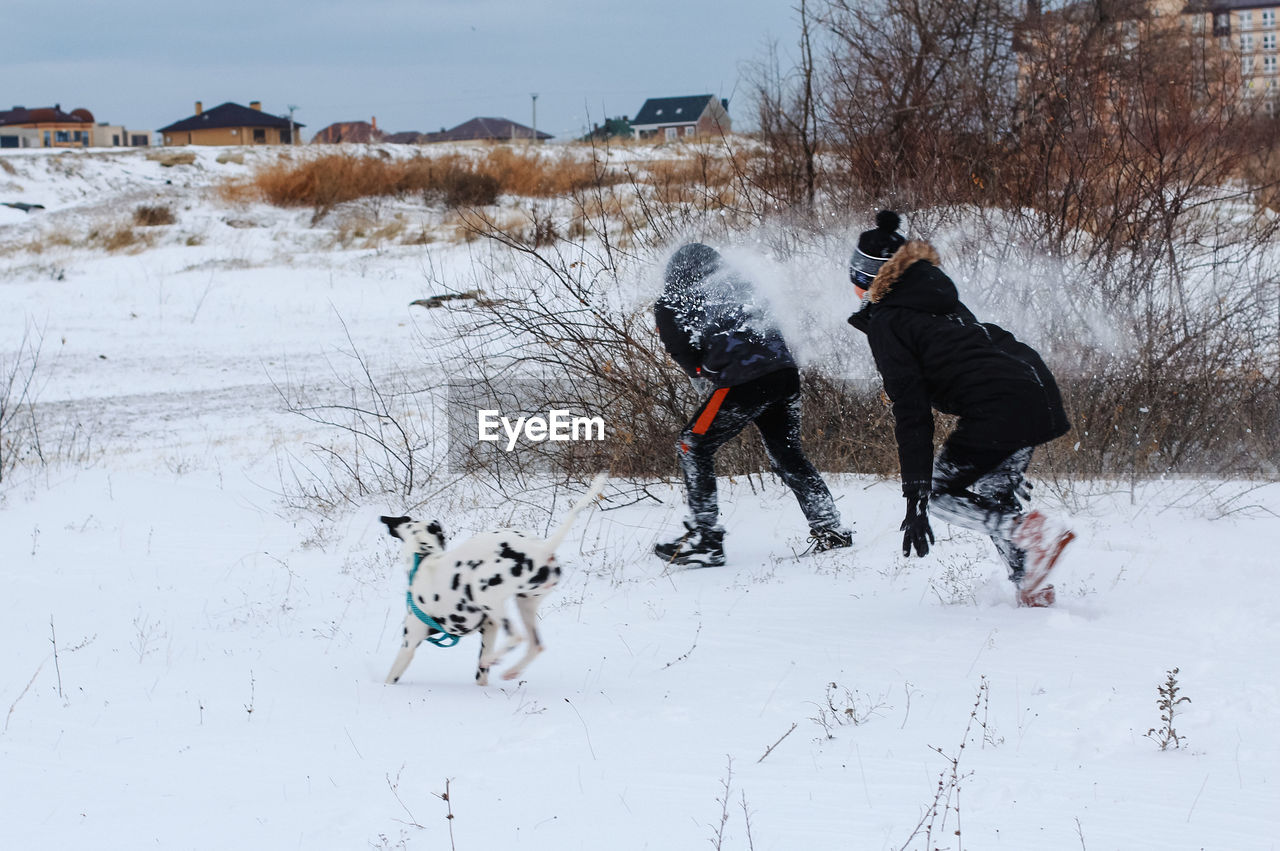 People on snow field during winter