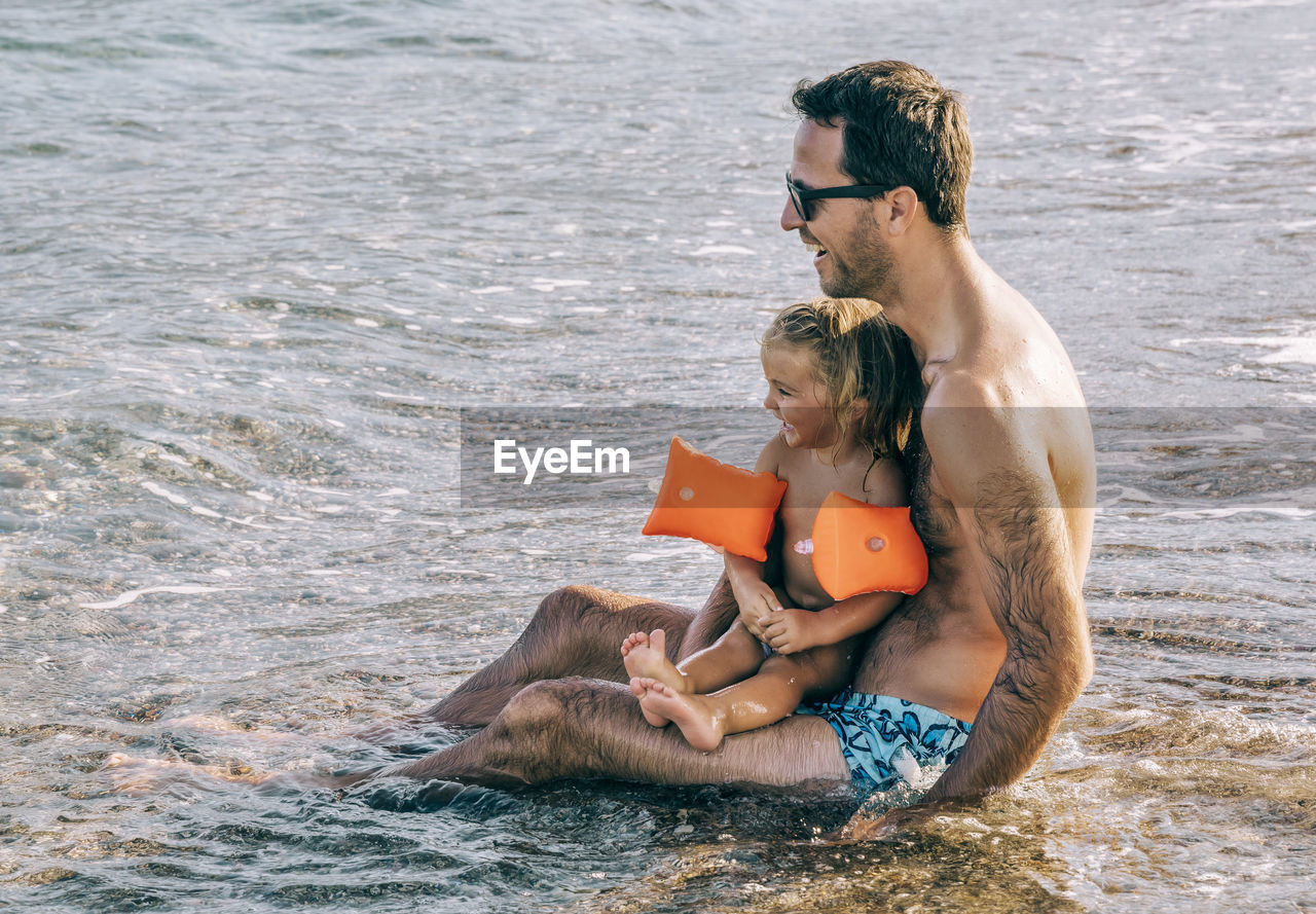FATHER WITH SON ON BEACH