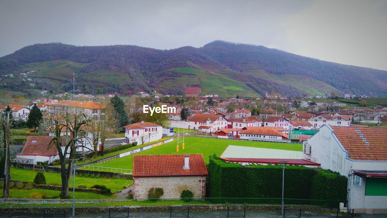 HOUSES ON MOUNTAIN RANGE