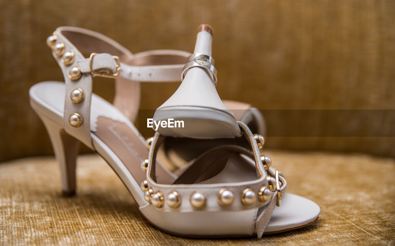 Close-up of high heels on table