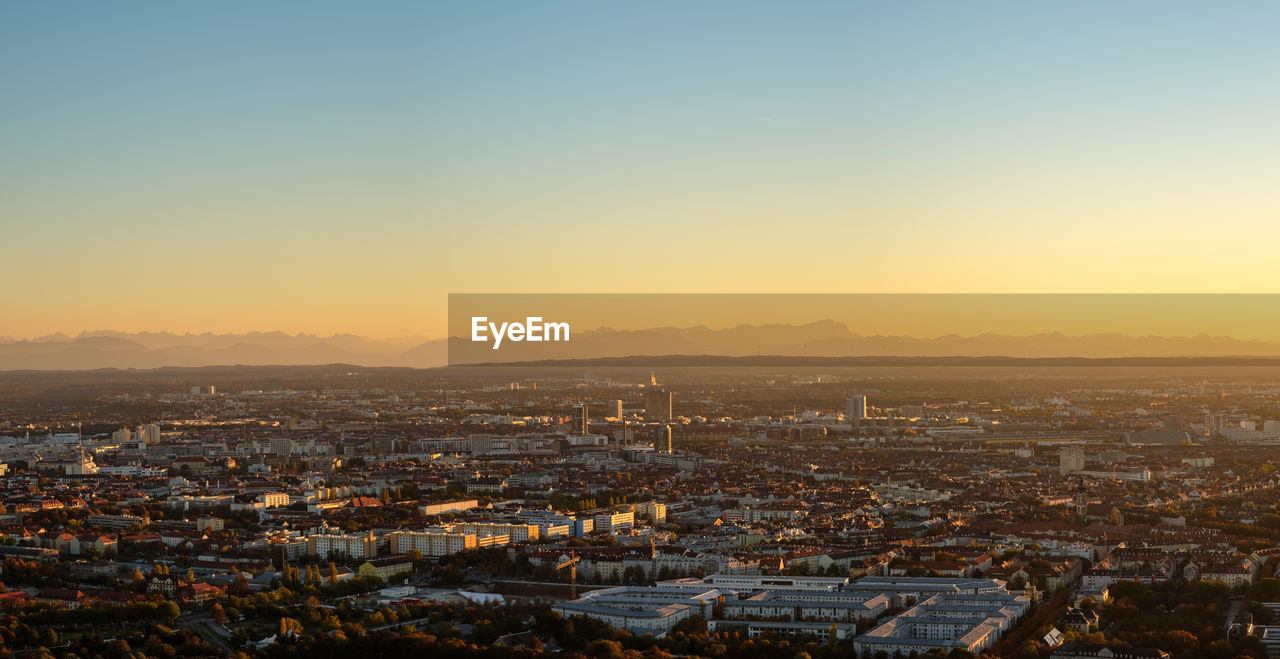 Munich panorama with alps in evening light and dusk