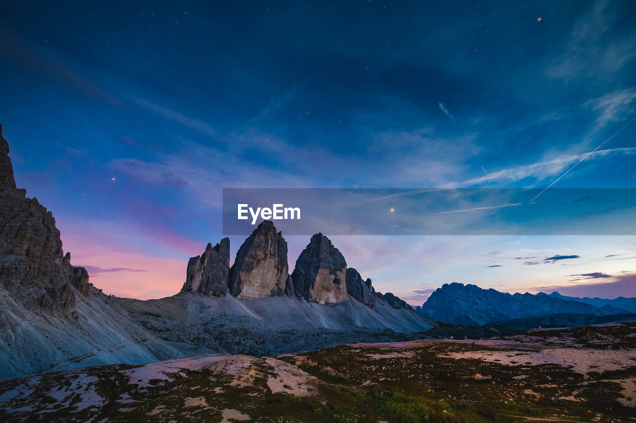 Scenic view of mountains against sky during sunset. tre cime di lavaredo, dolomites