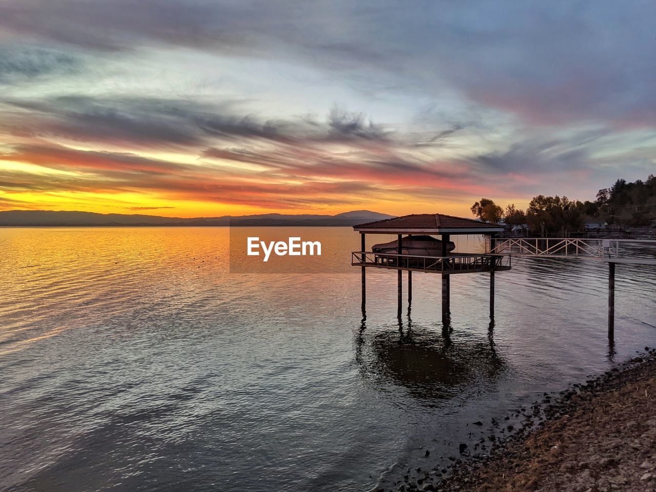 SCENIC VIEW OF SEA DURING SUNSET