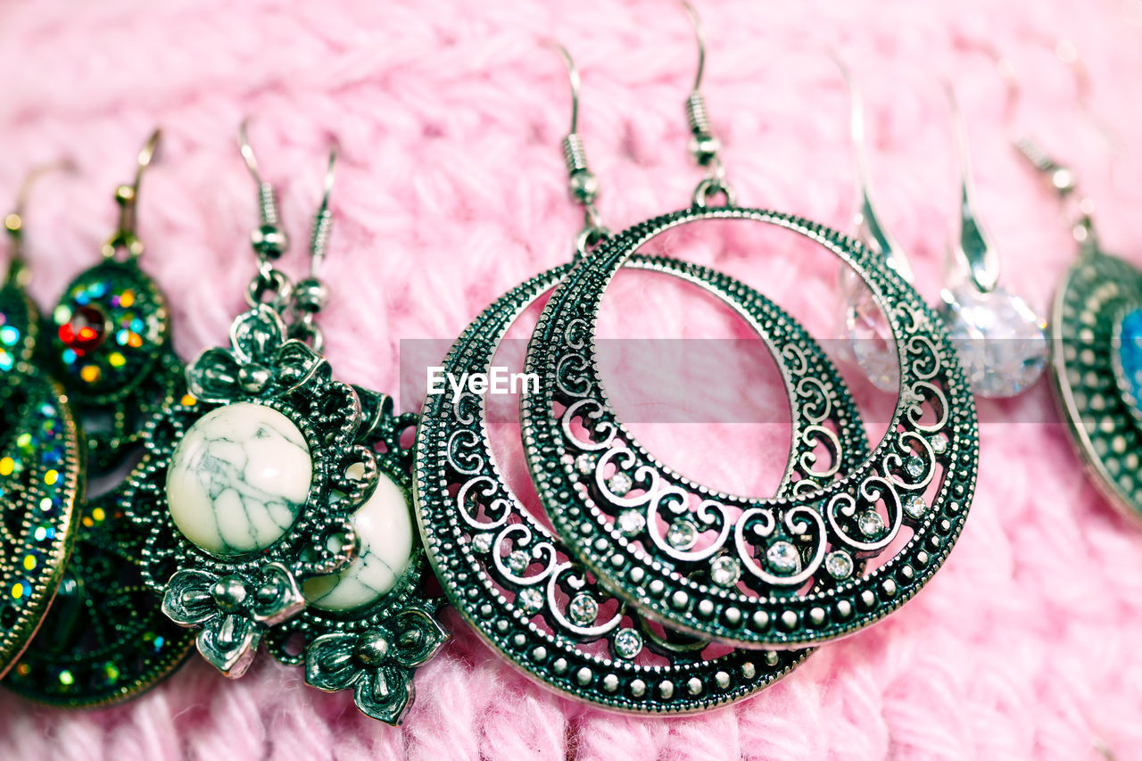 Silver hoop earrings and precious stones . traditional balkan jewelry